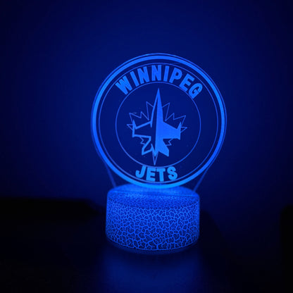 Blue Winnipeg Jets LED lamp on a dark background