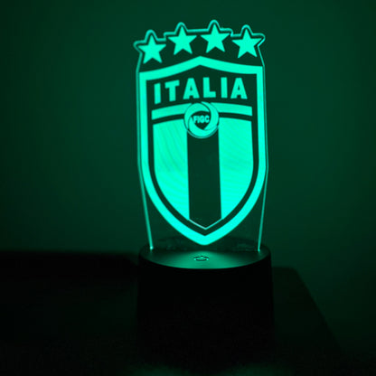 Green LED lamp with 'Italia' and star design on a dark background