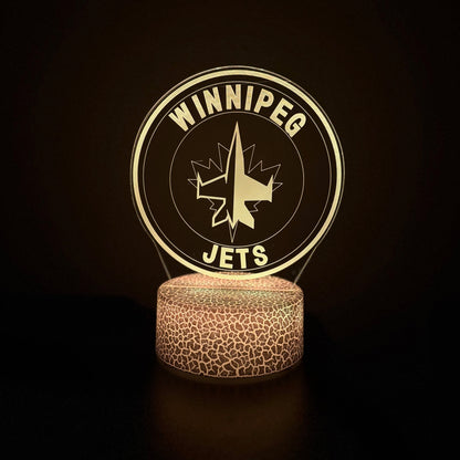 Winnipeg Jets-themed lamp with logo on a dark background