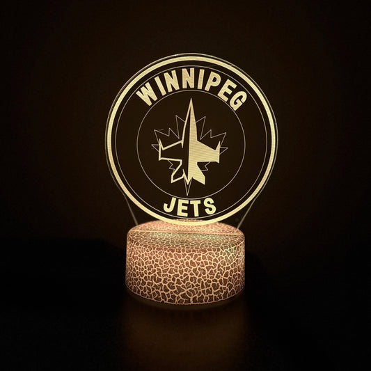 Winnipeg Jets-themed lamp with logo on a dark background